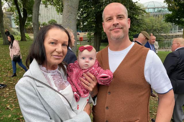 Michelle and Tim Salisbury, who have a close connection to four stones in the new section of the Veterans' Walk path with granddaughter Poppy.