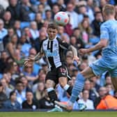 Newcastle United's English defender Kieran Trippier (L) vies with Manchester City's Belgian midfielder Kevin De Bruyne during the English Premier League football match between Manchester City and Newcastle United at the Etihad Stadium in Manchester, north west England, on May 8, 2022. (Photo by PAUL ELLIS/AFP via Getty Images)