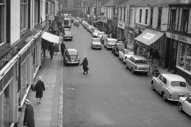 Blandford Street in 1961 with plenty of parked cars on either side of the road. How many of you struggled to get your car's choke working properly?