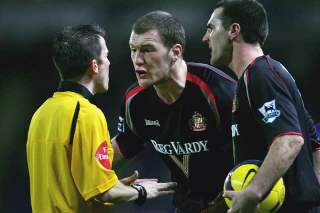 BLACKBURN, UNITED KINGDOM - FEBRUARY 15:  Kevin Kyle (C) and Tommy Miller (R) of Sunderland argue with referee Keith Stroud during the Barclays Premiership match between Blackburn Rovers and Sunderland at Ewood Park on February 15, 2006 in Blackburn, England.  (Photo by Alex Livesey/Getty Images)