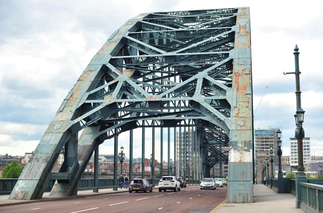 The iconic Tyne Bridge on the River Tyne between Newcastle and Gateshead which is in an alarming state, covered in rust patches and grafitti.