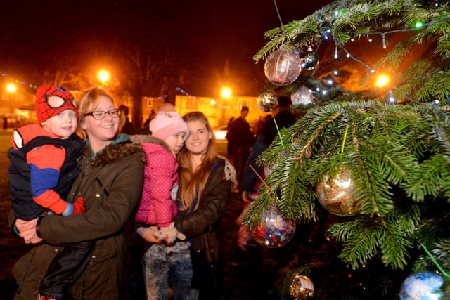 Kira Ross (left) and Bethany Buckley showing family friends, twims Karter and Keisha Wilson (4) the Ryhope Village Christmas tree in 2014.