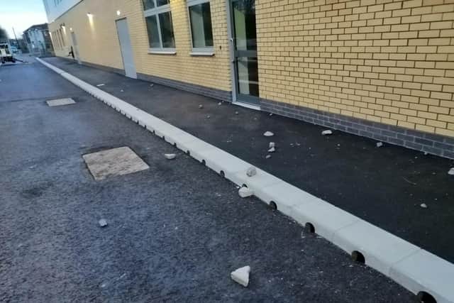 Rocks litter the ground after they were thrown at the Harry Watts Academy building in Hylton Red House over the weekend.