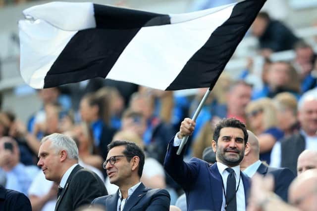 Mehrdad Ghodoussi, husband of Newcastle United's English minority owner Amanda Staveley waves a flag in the crowd ahead of the English Premier League football match between Newcastle United and Leicester City at St James' Park in Newcastle-upon-Tyne, north east England on April 17, 2022. -  (Photo by LINDSEY PARNABY/AFP via Getty Images)