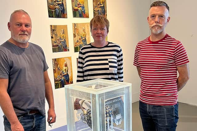 Artist Andrew Livingstone, left, with fellow artist Andrea Walsh and curator Gregory Parsons (right) in front of one of Bouke's beautiful pieces