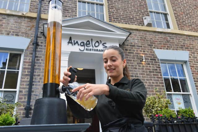 Angelo's Sofia Trovero with the 3 litre beer tower.
