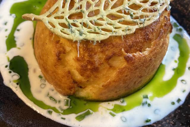 twice-baked cave aged Cheddar souffle with chives and parmesan cream