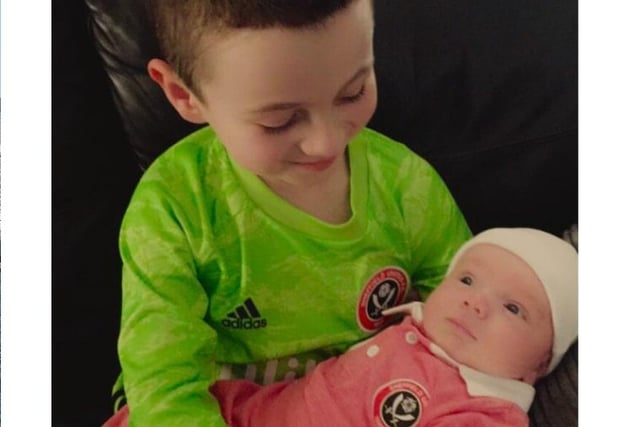 Eden, aged seven, and Lyle who was just three days old when this photo was taken in January.
