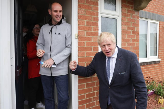Residents look shocked to see the Prime Minister Boris Johnson knocking on their door. 

Picture by Andrew Parsons CCHQ / Parsons Media