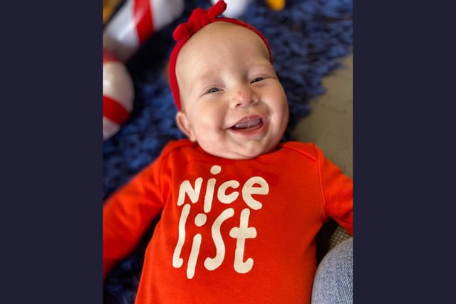 Jasmine, age 4 months, assures us she'll be on Santa's good list for her first Christmas.