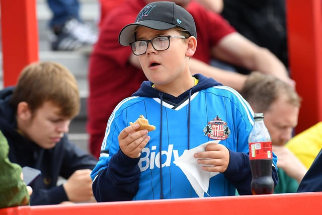 A Sunderland fan enjoys some scran at the Wham Stadium.