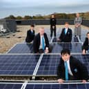 Kepier Academy's Eco Club committee and teachers on the school roof with the recently installed solar panels.