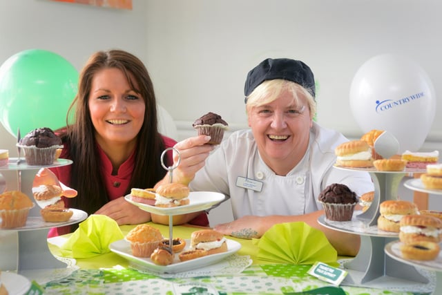 Preparing for the Macmillan World's Biggest Coffee Morning event at the Barnes Court Care Home in 2013. Activities organiser Claire Lambert and Head Chef Lynne Brown were ready to fundraise.