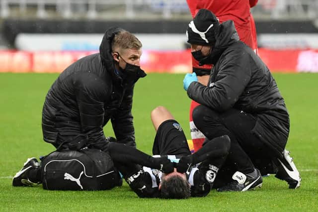 Fabian Schar gets treatment before being stretchered off.