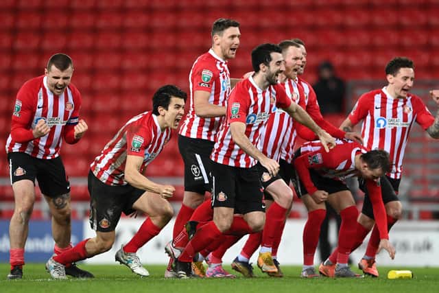 Sunderland players celebrate the penalty shoot-out victory after the Papa John's Trophy semi-final match between Sunderland and Lincoln City.