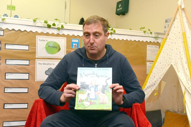 The children select the book A Squash and a Squeeze by Julia Donaldson for story time.
