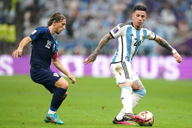 Argentina's Enzo Fernandez (right) and Croatia's Luka Modric battle for the ball during the FIFA World Cup Semi-Final match at the Lusail Stadium in Lusail, Qatar. Picture date: Tuesday December 13, 2022.