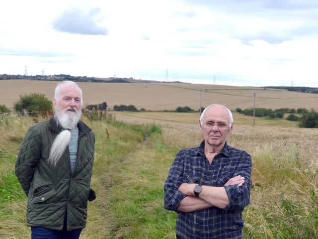 Chair of Murton Parish Council Paul Penman, left and Murton resident Ron Winn and oppose the solar farm which will be built on the land behind them . Picture, Sunderland Echo.