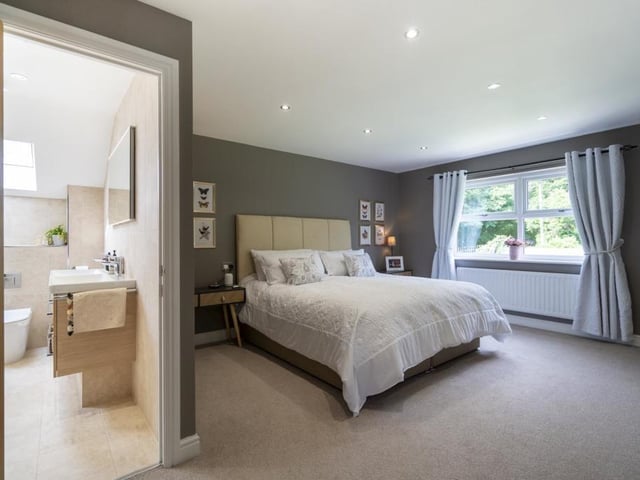 The bedroom has a double glazed window, recessed spot lighting and two radiators.