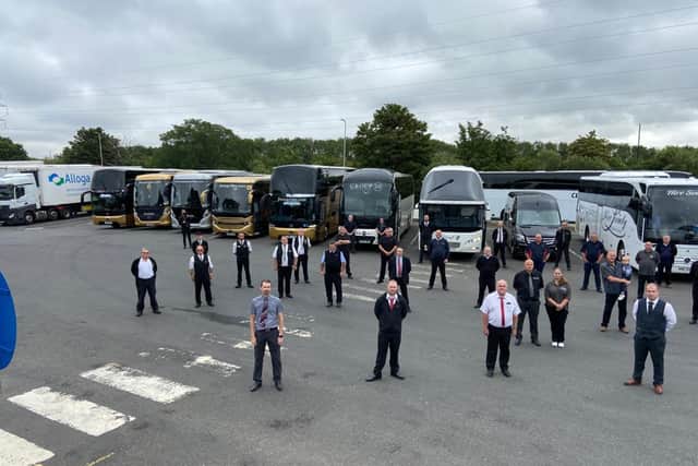 Coach drivers get ready to take part in the convoy.