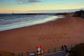 A poignant tribute message to Queen Elizabeth II, inscribed into the sand on Roker Beach.

Photograph: John Alserson