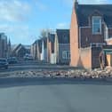 Storm Malik causes a brick wall to partially collapse, spilling onto the road in Roker, Sunderland