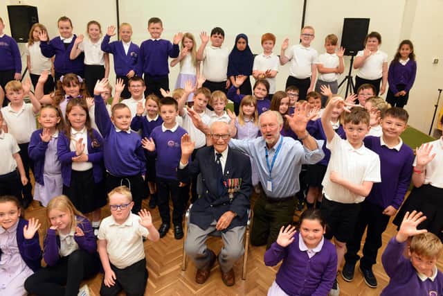 Hasting Hill Academy assembly hosted by 101 year old veteran Len Gibson with Daft as a Brush founder Brian Burnie.