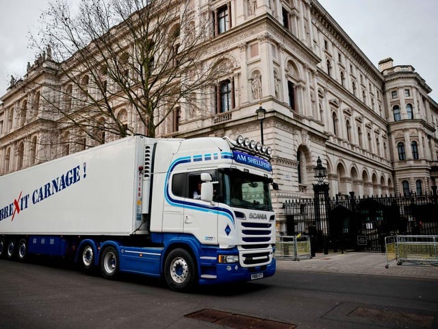 A truck drives past Downing Street with a message that reads "Brexit carnage!" in a protest action by Scottish fishermen against post-Brexit red tape and coronavirus restrictions, which they say could threaten the future of the industry, in London. (Photo by Tolga Akmen / AFP)