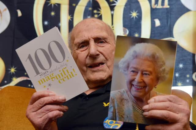 George Bell celebrates his 100th birthday with a card from the Queen.