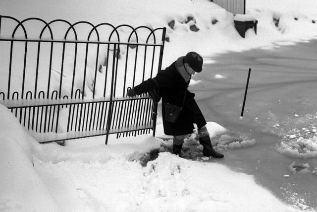 Taking extra care on the snow and ice in 1947.