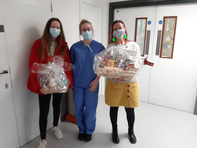 Kayleigh Llewellyn donates hampers and presents to the Freeman Hospital.