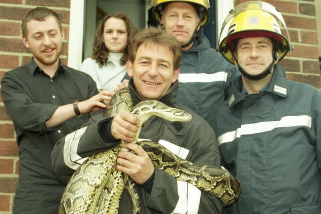 Firefighter Dave Ellison is pictured with Oscar the rescued python in 1997.  Left to right are owners Paul Mariner and Lisa Nichols, firefighter Alan Baitey and Sub-officer Keith Reynolds.