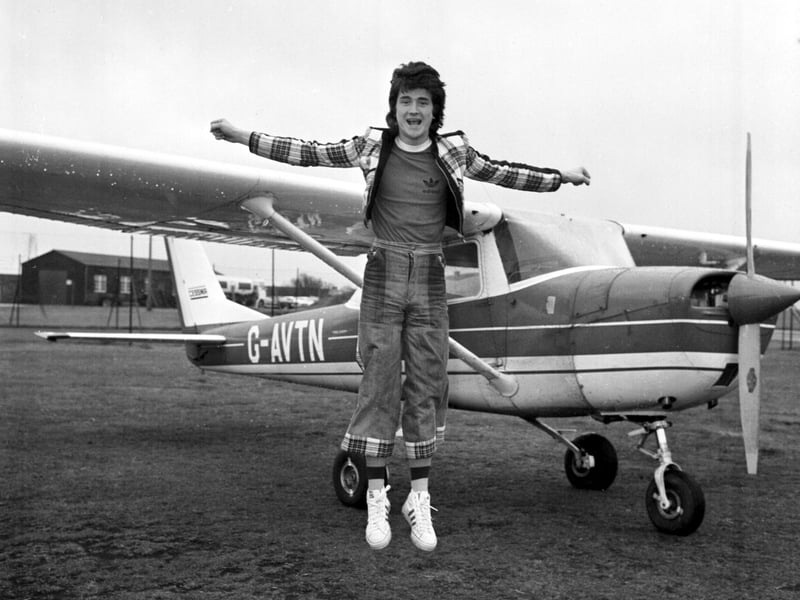Les McKeown of the Bay City Rollers takes flying lessons at Turnhouse airport (Edinburgh airport) in April 1975.