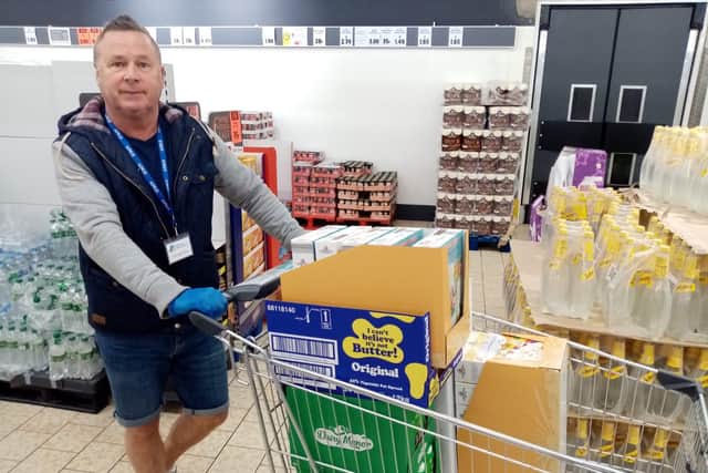 Dave Ellison with shopping for vulnerable people