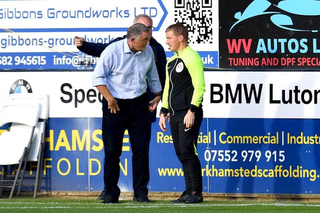 Sunderand head coach Tony Mowbray talks with the fourth official during the Championship clash against Luton Town at Kenilworth Road