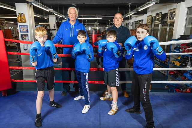 Boxers (front, from left) Grayson Fenwick, Harry Richardson, Franklin Heath and Daniel Holden with club chairman Owen McGhin and Giles McCourt
