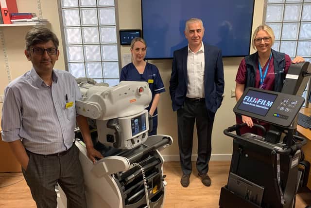 Consultant Dr Imran Ahmed, Neonatal Intensive Care Unit Ward Manager Emily Cameron, Consultant Majd Abu-Harb and Reporting Radiographer Brittany Burgess with the traditional X-ray machine and the new machine.