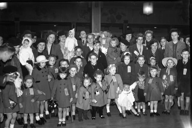Evacuees from London assembling in the New Rink in Park Lane before going home in 1945.