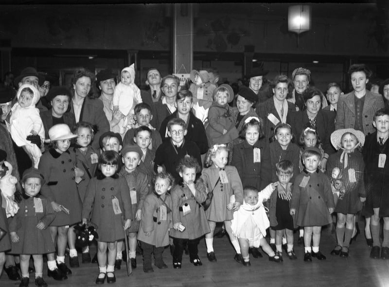 Evacuees from London assembling in the New Rink in Park Lane before going home in 1945.