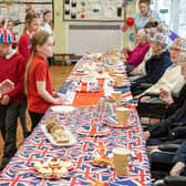 Children from Plains Farm Academy enjoy a chat with residents from the Village Care Home.