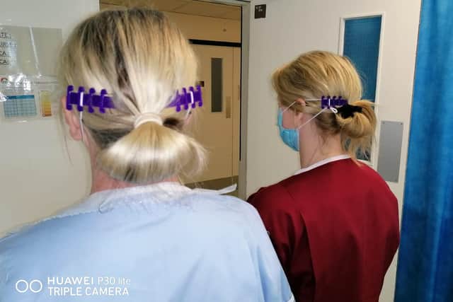 NHS staff wearing the 'ear savers' made by Harriet and Isabella