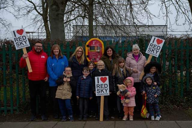 (from left) Sergio Petrucci, Lesley Ferguson, head Nicola Hair, Helen Anderson and Barbara Howard, with grandchildren Elise and Louisa Goldsmith and pupils