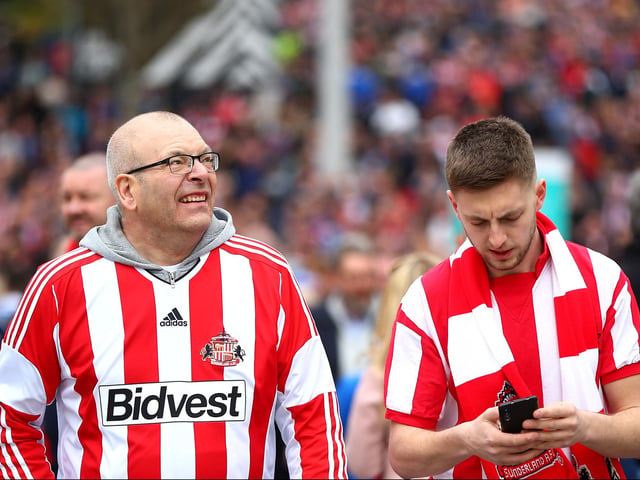 Fans make their way to the stadium ahead of the Checkatrade Trophy final between Portsmouth and Sunderland at Wembley Stadium on March 31, 2019.
