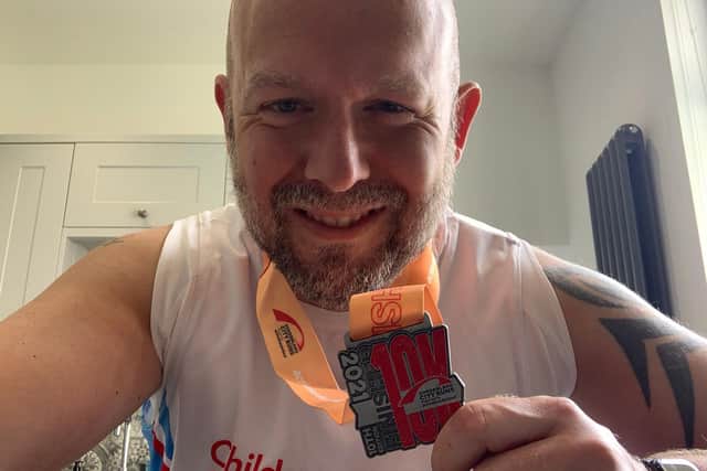 Chris Johnson with his Sunderland 10K medal.