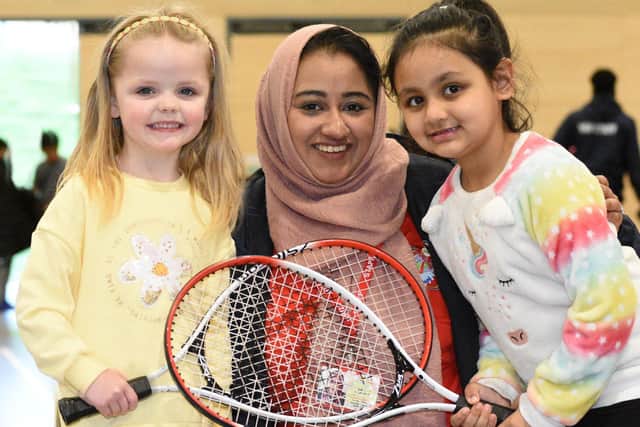 YAV Employment Support Worker, Hamida Begum , four-year-old Jessica Lambert and five-year-old Iqra Ahmed enjoy a game of tennis at the Beacon of Light.