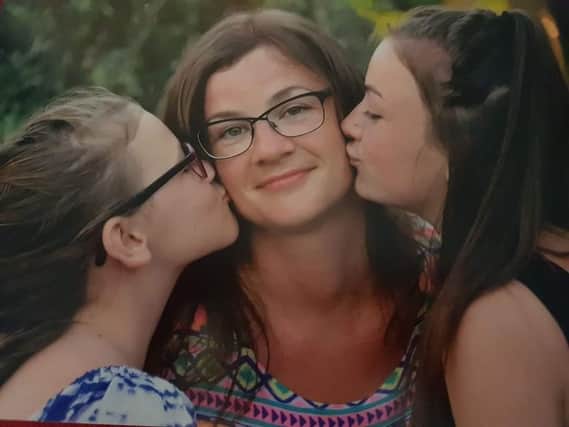 Devoted mum Leanne Little with daughters Amelia and Olivia
