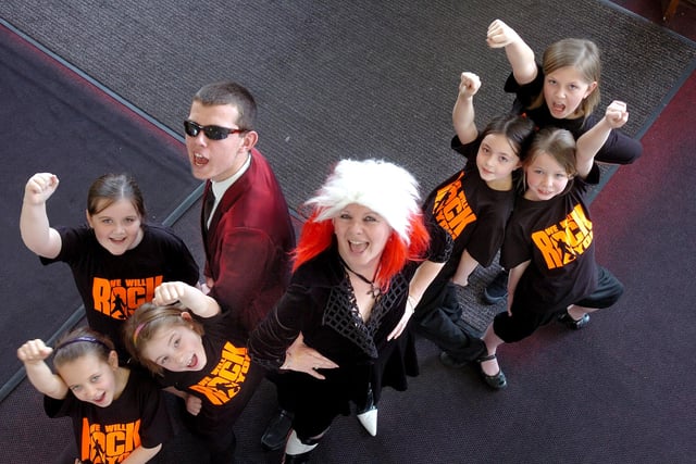 A scene from "We Will Rock You" at Southmoor School in 2012. Teacher Anne Twine played the Killer Queen with her assistants played by Year 5 pupils from Hill View Junior School; Natasha Hair, Josie Appleby, Emma Bell, Grace Kennedy, Faye Potts and Gracie Mitchell..