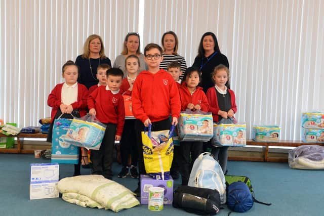 Members of the school team with just some of the donations already received