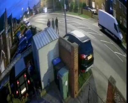 Police want to trace the three males in this still taken from a video following a suspected arson attack.