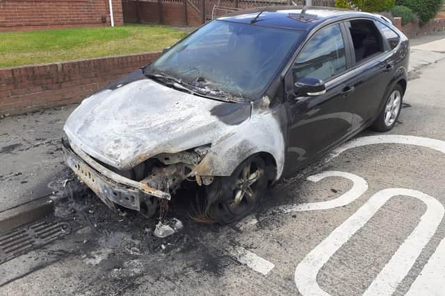 The burnt-out car in Gleneagles Road, Grindon.